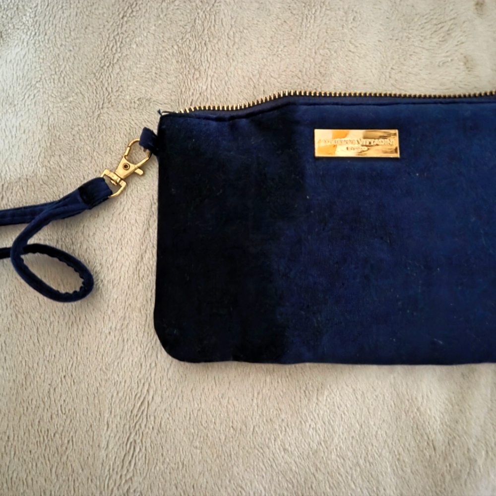 Luxurious navy blue velvet clutch with gold trim